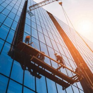 Modern Skyscraper Construction with Crane and Glass Facade Workers